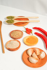 variety of spices and herbs prepared on the white table. food condiment recipes that is most commonly used. suitable for social media or website presentation.