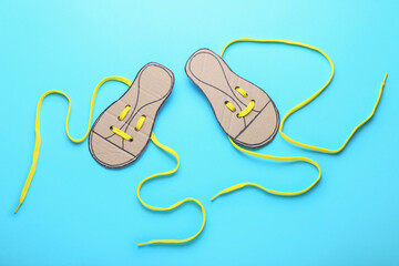 Shoe lacing cards with long laces on color background