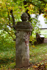 Fototapeta na wymiar fretwork on column in red bricks Garden with tall poplar trees terracotta brick pillar