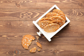 Wooden drawer with tasty chocolate cookies on wooden background