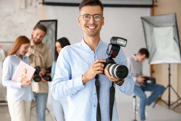Male photographer during classes in studio