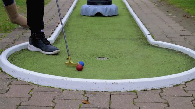 playing mini golf in autumn in germany
