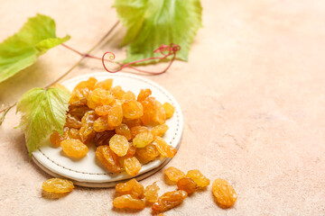 Stand with tasty raisins on color background, closeup