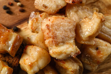 Tasty cracklings on table, closeup