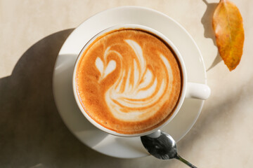 Cup of tasty coffee on table