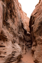 Hiking through a canyon of the White Domes Trail in the Valley of Fire, Nevada
