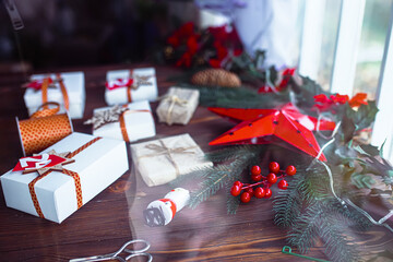 View from the window on boxes for the advent calendar. Preparing to celebrate the New Year or Christmas. Gift wrapping for the New Year. Handmade Decorating gift boxes