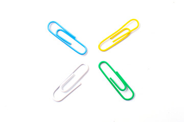 Obraz premium Colorful plastic paper clipson on a white background