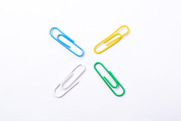 Colorful plastic paper clipson on a white background
