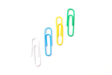 Colorful plastic paper clipson on a white background