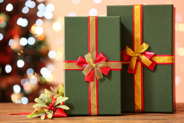 Christmas gift boxes on table against blurred background