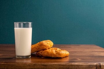 glass with milk on a wooden table. milk for breakfast. fresh milk