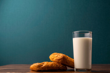 glass with milk on a wooden table. milk for breakfast. fresh milk