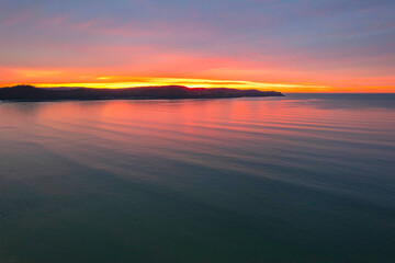 One hundred percent cloud covered sunrise over the sea