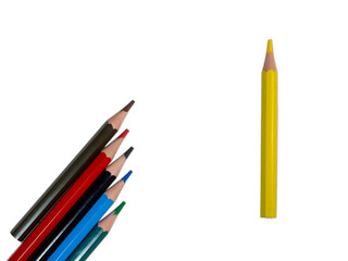 colored short pencils. Wooden pencils are laid out on a white background.