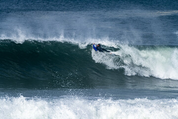 Bodyboarder surfing ocean wave