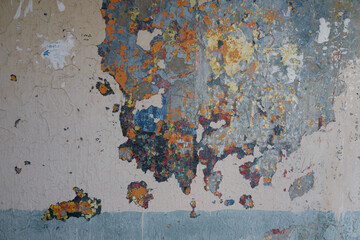 The texture of the multilayer old painted wall.
