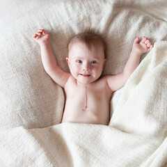 Portrait of a positive girl with Down syndrome.