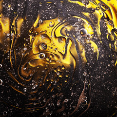 Abstract space surreal yellow black golden background, oil bubbles in water