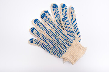 Construction worker protective knitted dotted gloves on white background, hand protection and safety while building