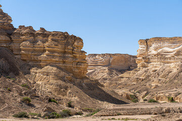 Rocky Formations. Unique rock formations stand tall in the Omani desert, testament to the region's rich geological history and nature's artistry.