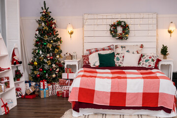  Spacious white light bedroom in a loft style with a decorated Christmas spruces