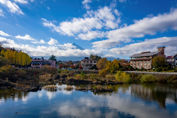 Mount Fujiyama in Japan. Hotels shores of lake kawaguchiko. Fujikawaguchiko city in sunny weather. Mount Fuji is hidden behind clouds. Fujikawaguchiko Tourism. Travel five fuji lakes. Japan tourism