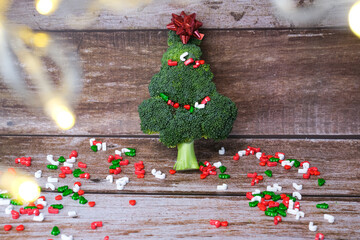 Christmas tree made from broccoli, on a wooden background, close-up, selective focus.2022,2023