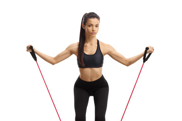 Young female exercising with a resistance band