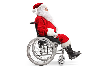 Full length profile shot of a santa claus sitting in a wheelchair