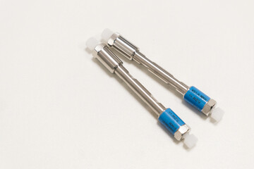 HPLC 50 mm columns on the table in the laboratory. Fast high performance liquid chromatography analysis in a chemical and microbiological laboratory. Clinical, toxicological and forensic analysis. 