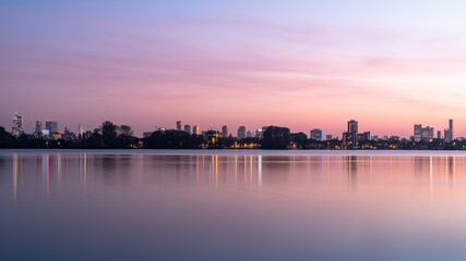 Fototapeta premium The skyline of Rotterdam during a pink sunset