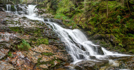 Fototapeta na wymiar The Rissloch waterfalls with a total height of 55 meters are the highest waterfalls in the Bavarian Forest