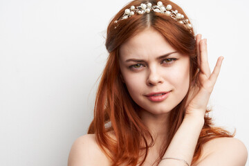Naklejka premium charming woman with fashionable hairstyle makeup emotions light background