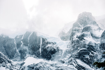 Obraz premium The wind blows away the snow from the mountain peaks, Torres del Paine National Park, Chile