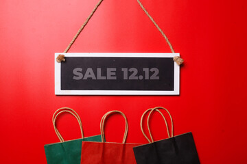 12.12 Shopping day super sale flat lay concept on red background  