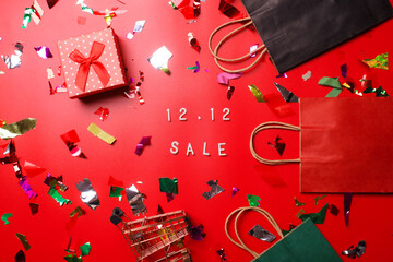 12.12 Shopping day super sale flat lay concept on red background  