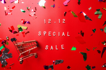 12.12 Shopping day super sale flat lay concept on red background  