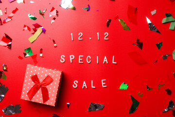 12.12 Shopping day super sale flat lay concept on red background  