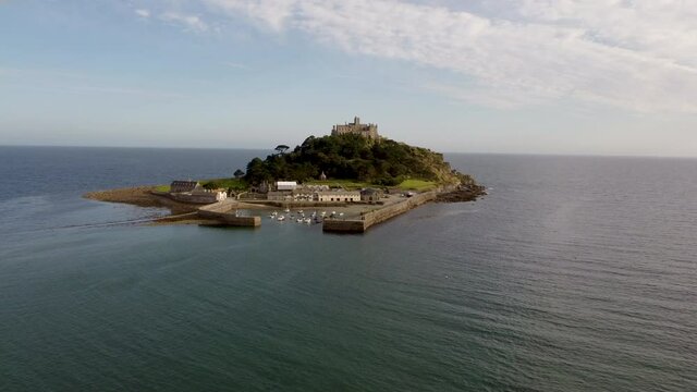 St Michael's Mount near Penzance in Cornwall, England Drone Aerial View - Slow Orbit Right to Left Coast-side