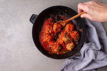 Meat balls in tomato sauce in a pan