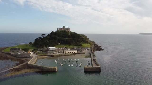 St Michael's Mount near Penzance in Cornwall, England Drone Aerial View - Slow Orbit Left to Right Coast-side