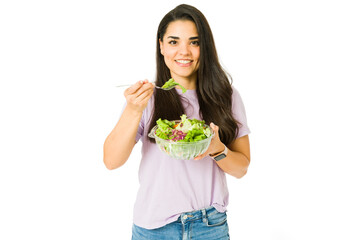 Portrait of a woman enjoying a salad