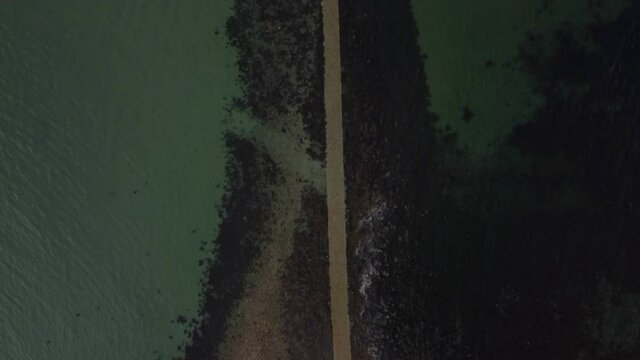 Birdseye View of Submerged Underwater Causeway leading to St Michael's Mount near Penzance in Cornwall, England - Drone Aerial View
