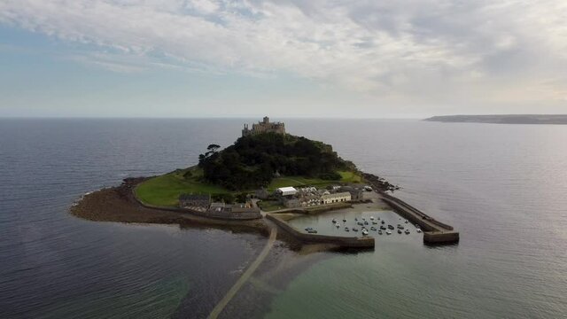 St Michael's Mount near Penzance in Cornwall, England Drone Aerial View - Slow Moving Away Coast-side
