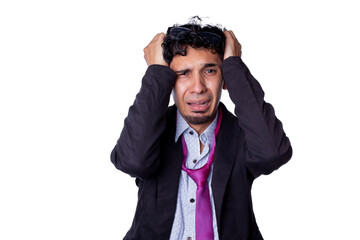 Frustrated and desperate businessman clutching his hair because he lost his job. Young adult about to cry over something bad that happened to him, wearing glasses on his head, on white background.