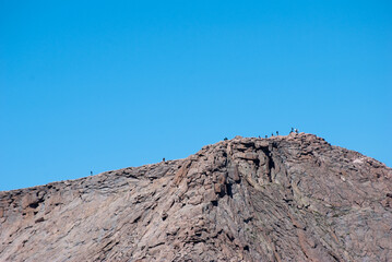 Fototapeta na wymiar People in the distance on top of Longs Peak in Rocky Mountain National Park in Colorado