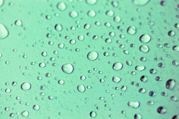 Fototapeta na wymiar Small oxygen bubbles under water. Clear transparent liquid rain drops background
