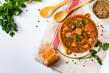 Beef Stew with Potatoes and Carrots made in a Slow Cooker. Selective focus.