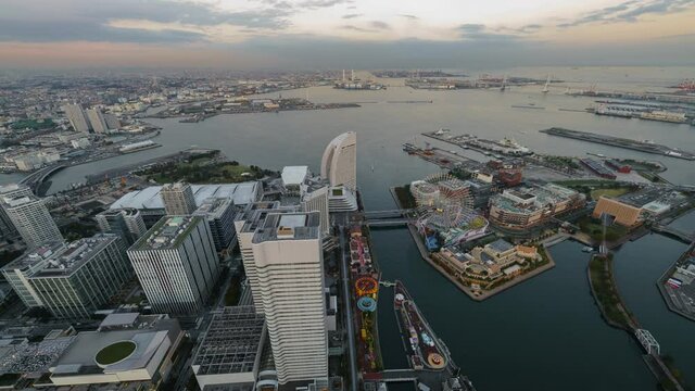 Time lapse day to night transition overview of Yokohama waterfront cityscape in Japan 